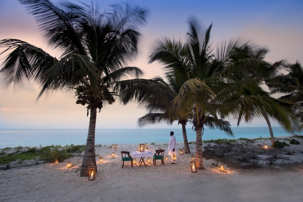 Private candlelit dinner beside the Indian Ocean