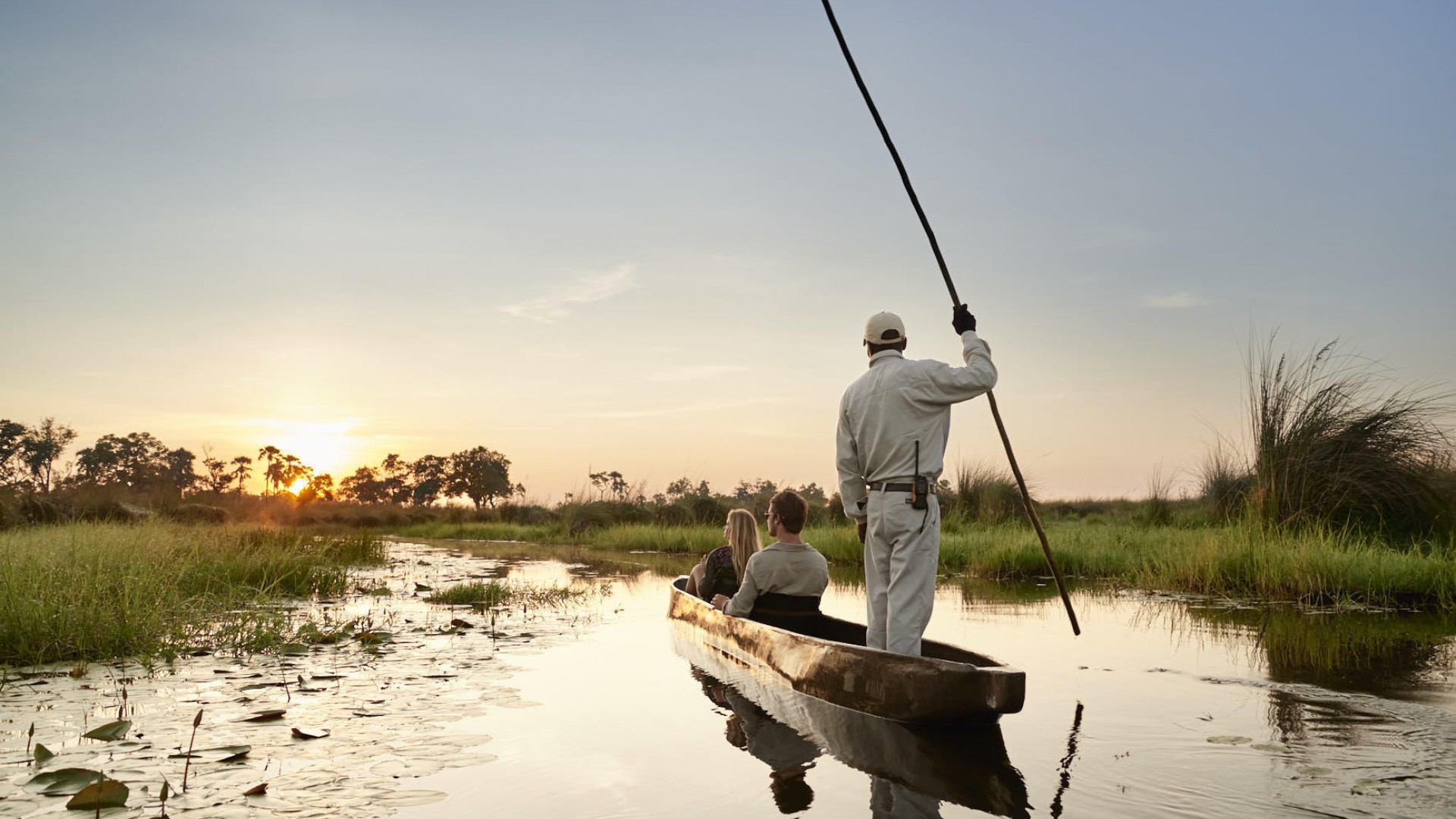 A tranquil mokoro safari at sunset