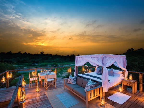 Romantic star bed sleepout in the African bush